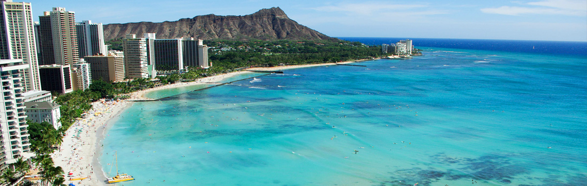 View from above looking down on hotels and tourists on Waikiki Beach and Diamond Head in Honolulu, Hawaii