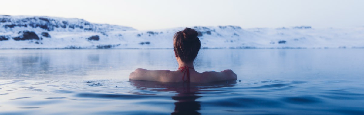 woman bathing in a hot spring in Iceland